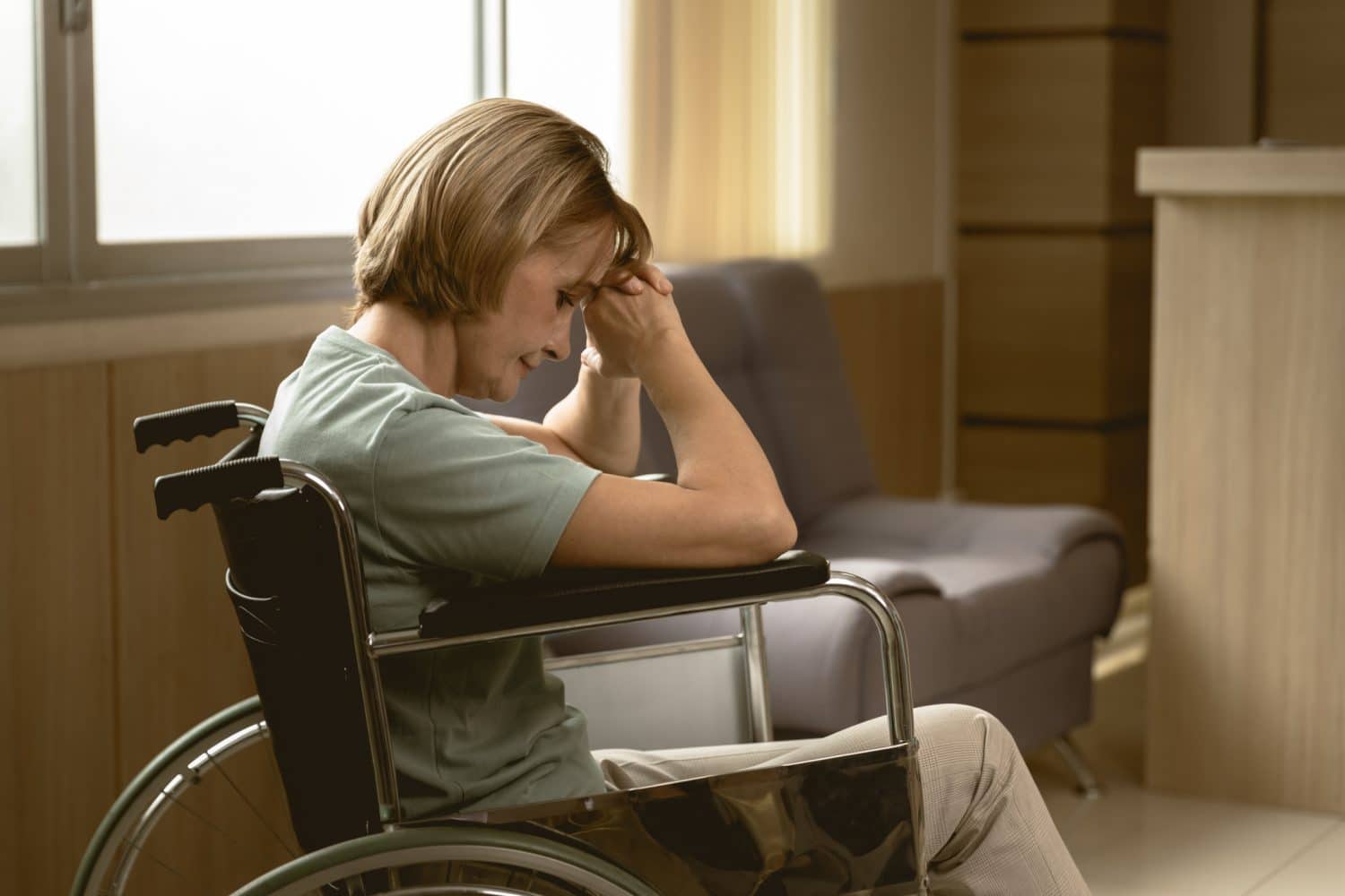 An adult woman sits alone in a wheelchair while being neglected in a hospital in Indianapolis.