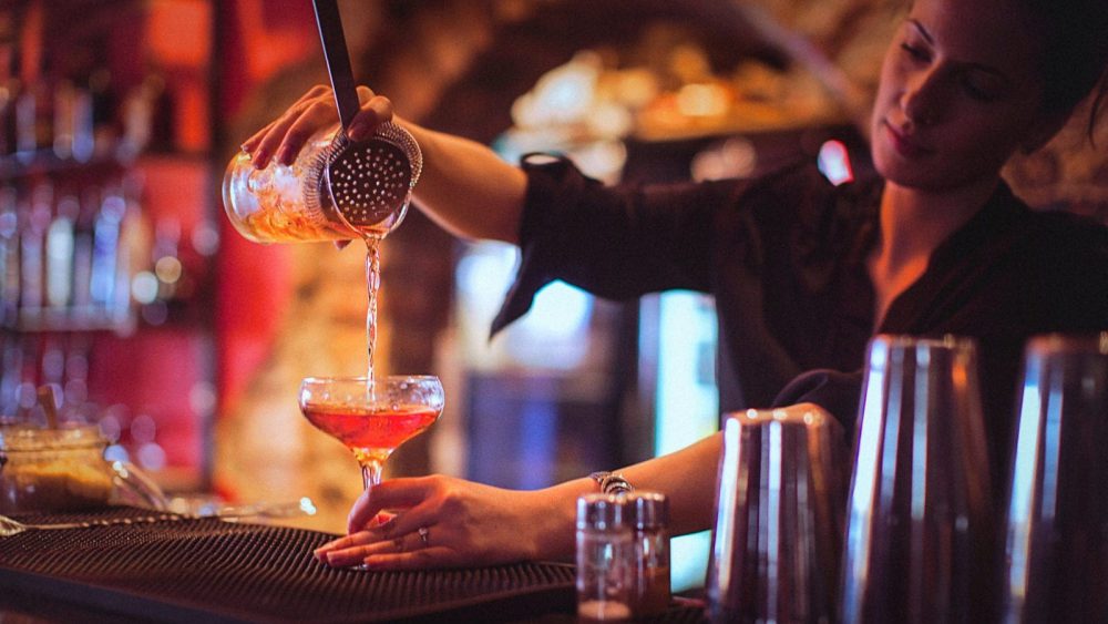 Bartender Pouring A Cocktail Stock Photo