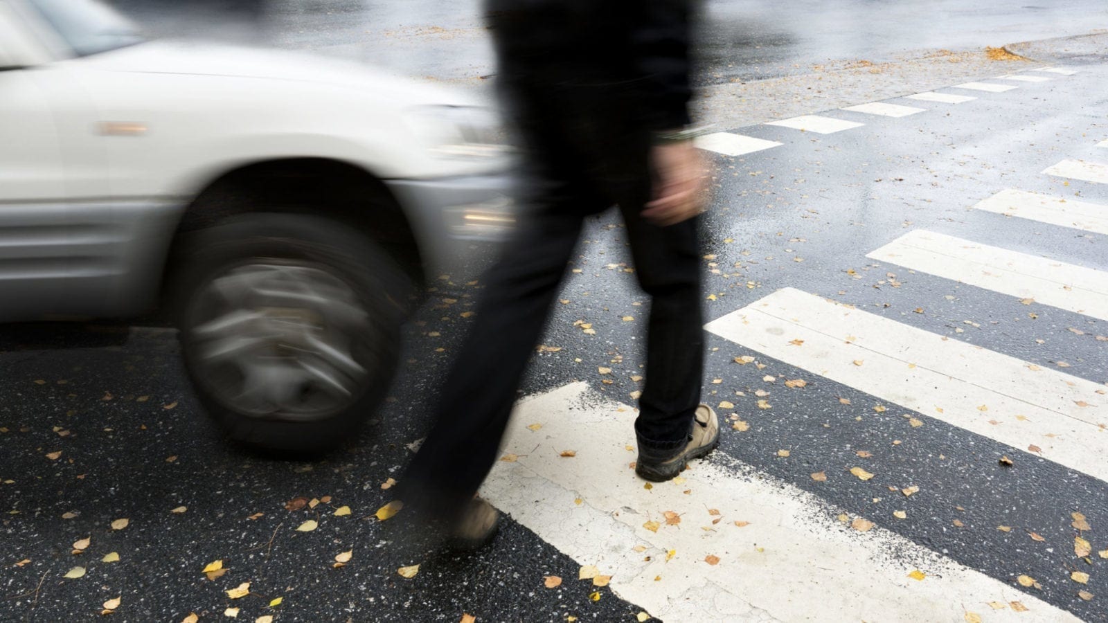 Small SUV Hitting A Pedestrian At A Crosswalk Stock Photo