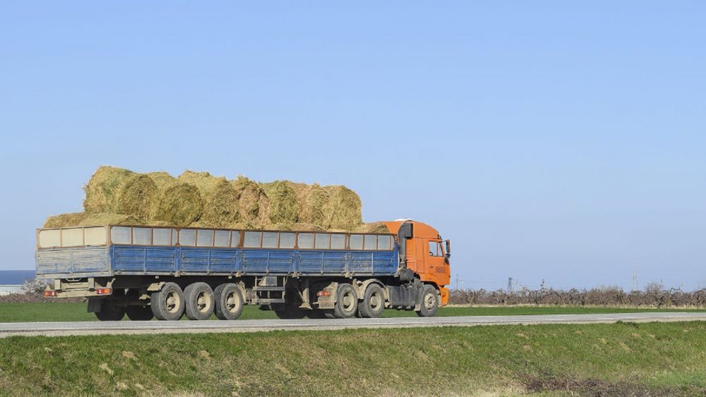 Large Truck Carrying Bails Of Hay Stock Photo
