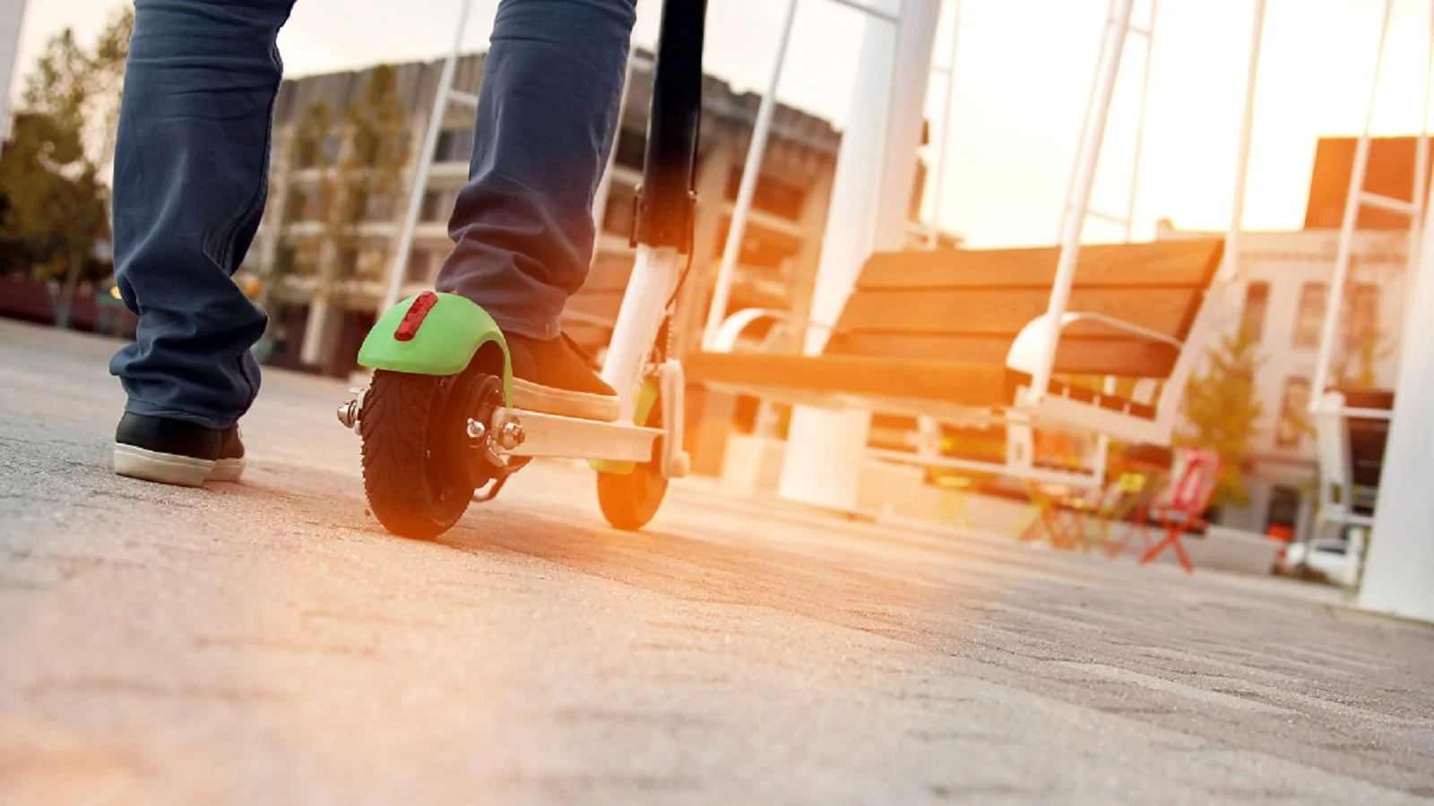 Young Man Riding An Electric Bird Scooter Stock Photo