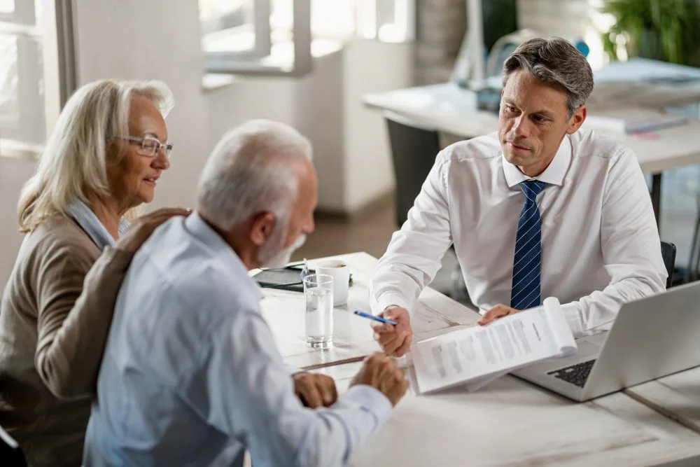 An Indianapolis couple meeting with their car accident lawyer to discuss settling their case.