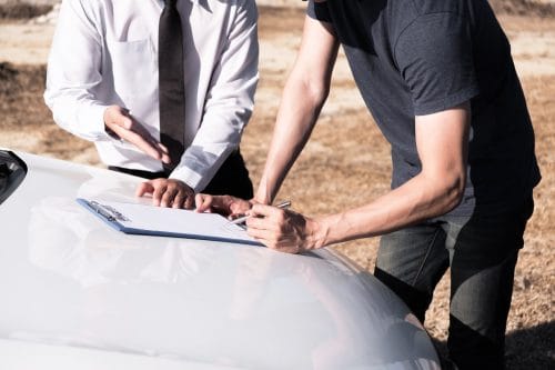 An Indianapolis man going over a car accident claim with an insurance adjuster.